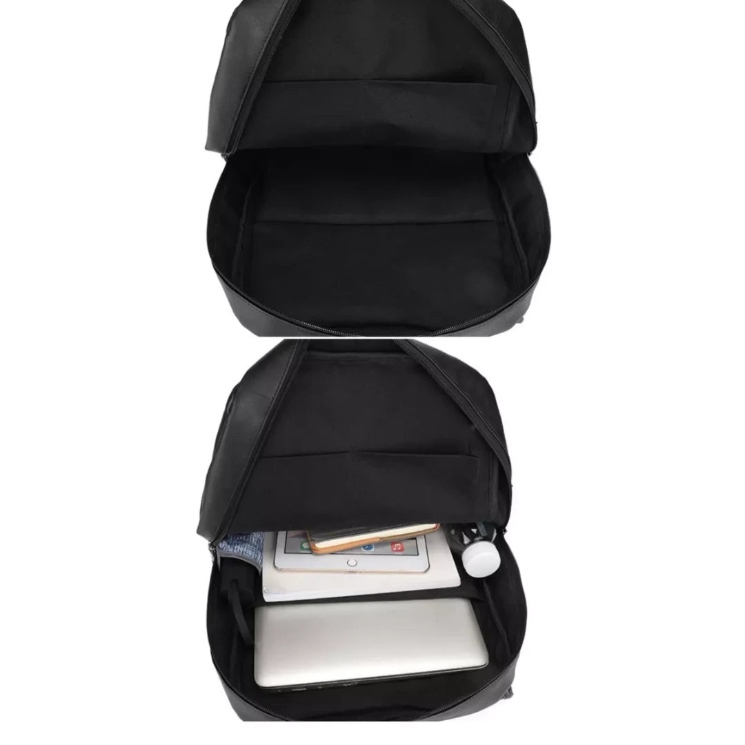 Black backpack with compartments showing a laptop and tablet inside on a white background