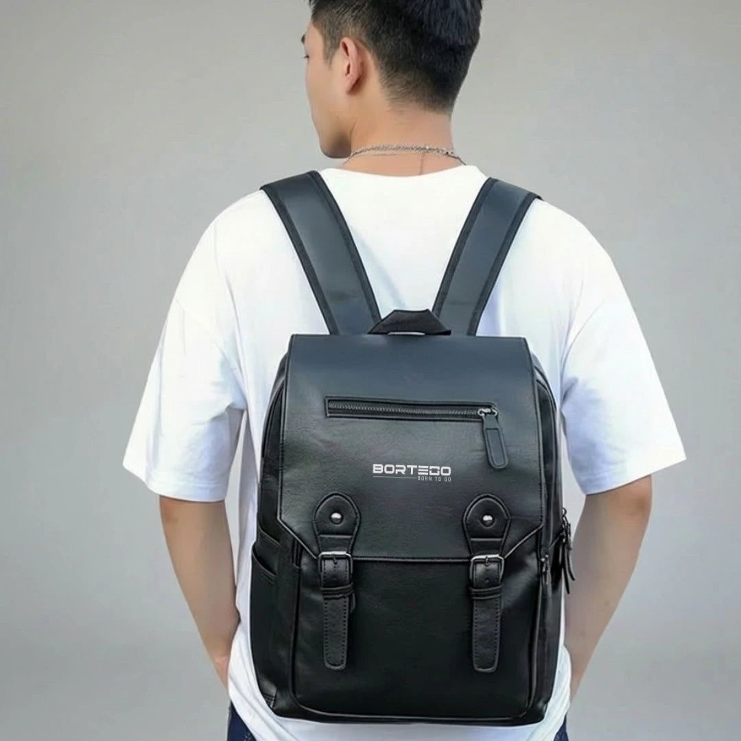 Person wearing a black backpack with 'Bortego' branding on a gray background