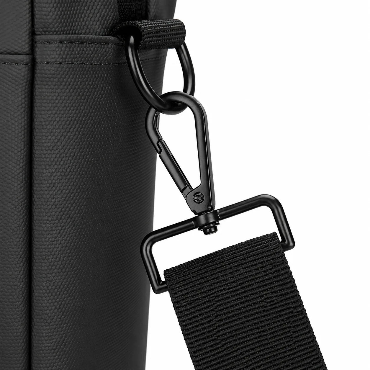 Close-up of a black textured bag with a black adjustable shoulder strap attached via a metal carabiner and D-ring, shown on a white background.