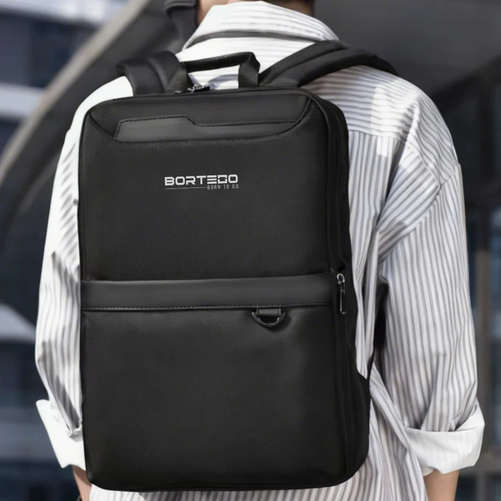 Person wearing a black backpack with 'Bortego' branding.