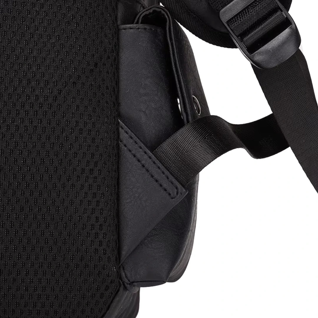 Close-up of a black backpack with a shoulder strap on a white background