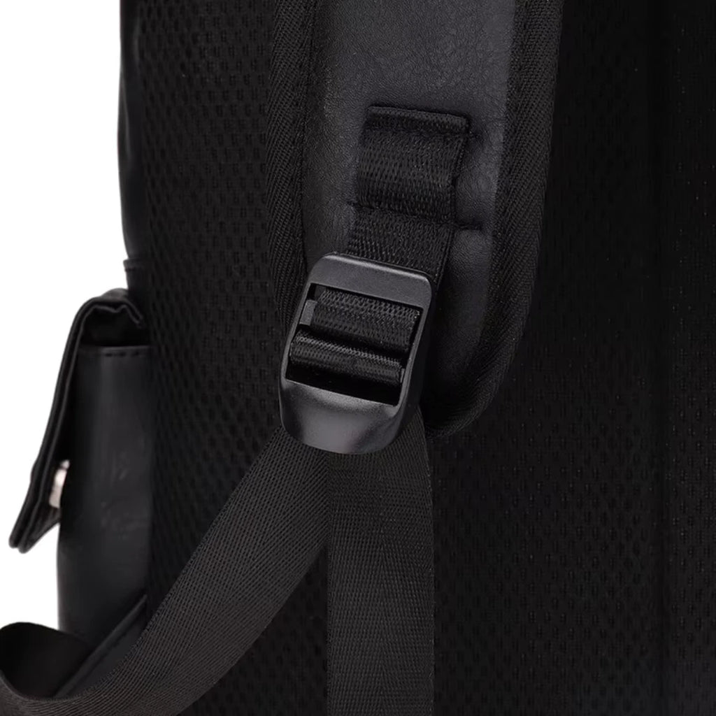 Close-up of a black backpack strap with buckle on a white background