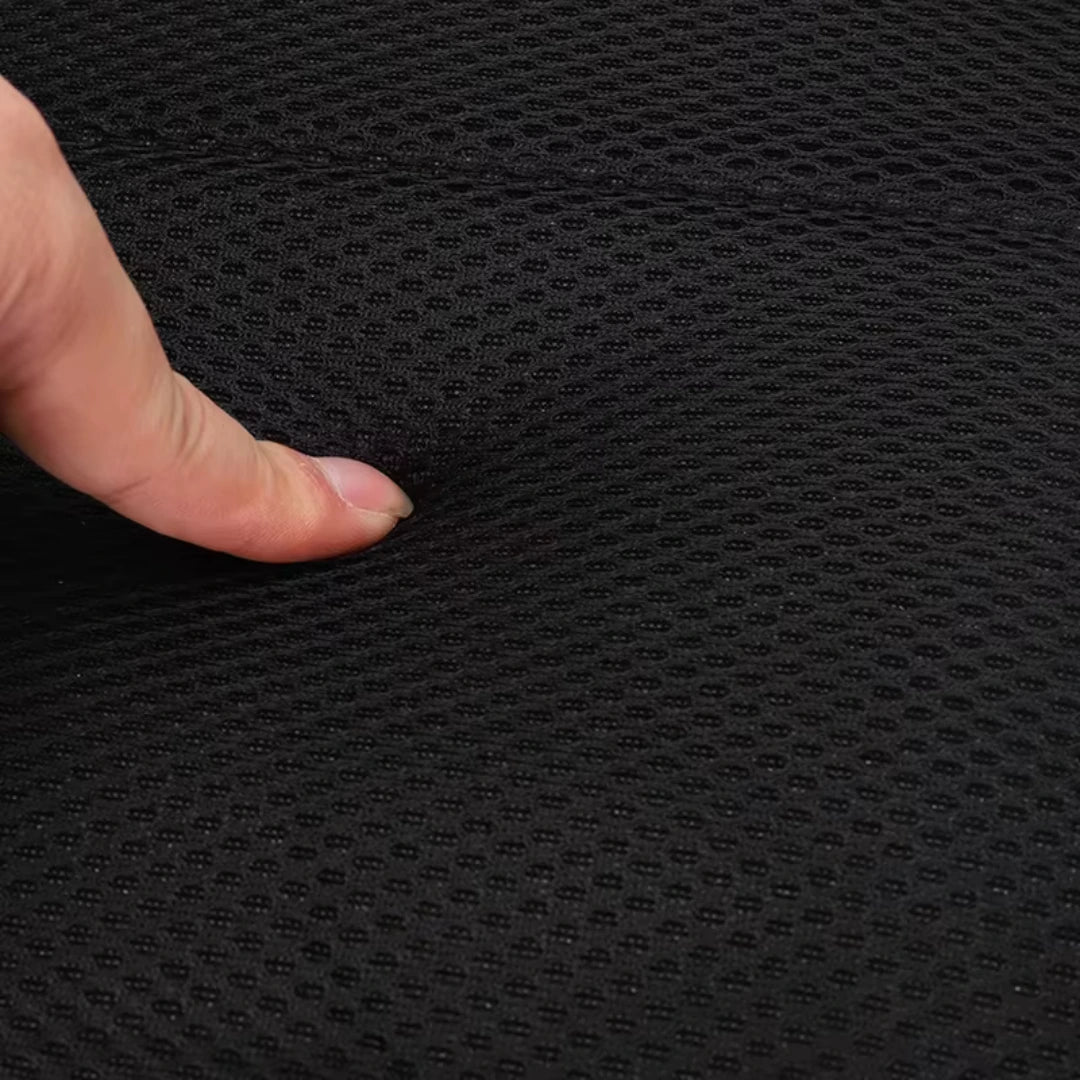 Hand touching a textured black surface