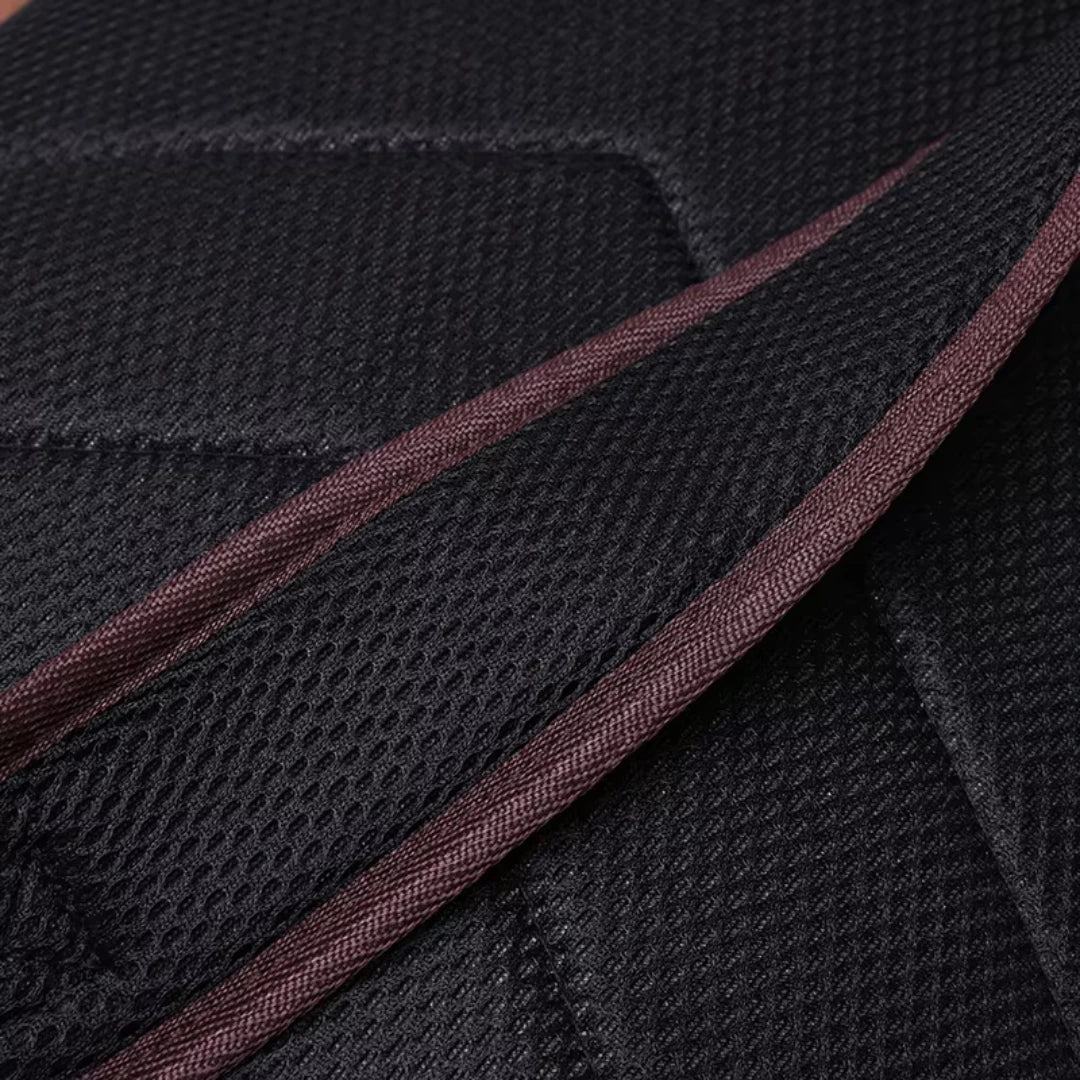 Close-up of black fabric with brown stitching