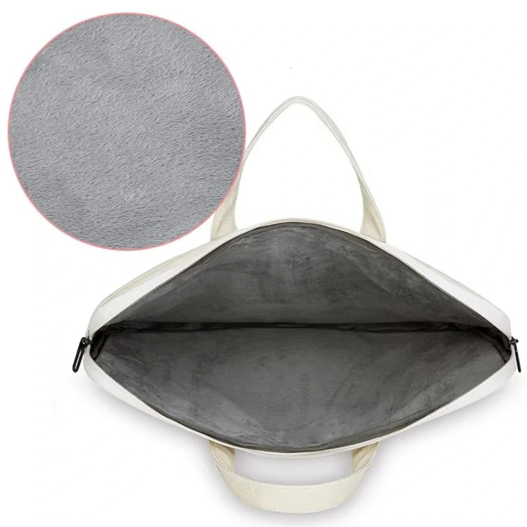 An open cream-colored bag with a dark gray interior, shown on a white background with a circular inset highlighting the gray fabric texture.