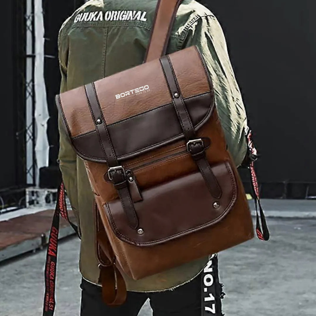 Person wearing a brown backpack Bortego  with visible branding in an urban setting