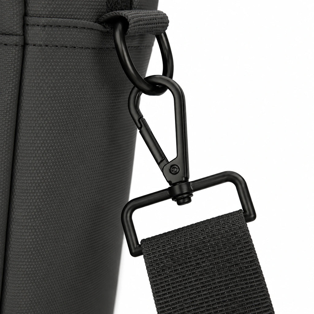 Close-up of a black textured fabric bag with a black metal carabiner and webbing strap attachment on a white background.