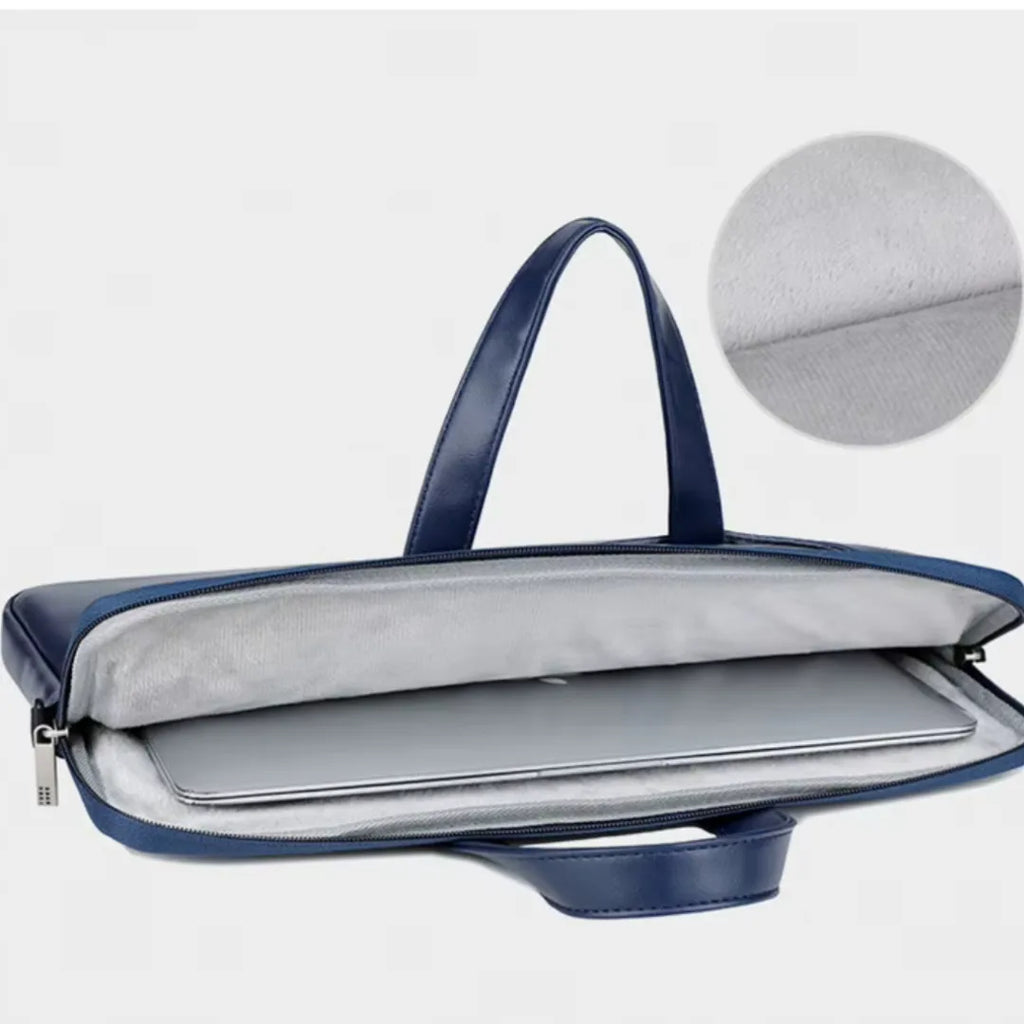 A navy blue laptop sleeve with a silver interior lining, shown open with a laptop inside. A circular inset in the upper right shows a close-up of the silver fabric lining.