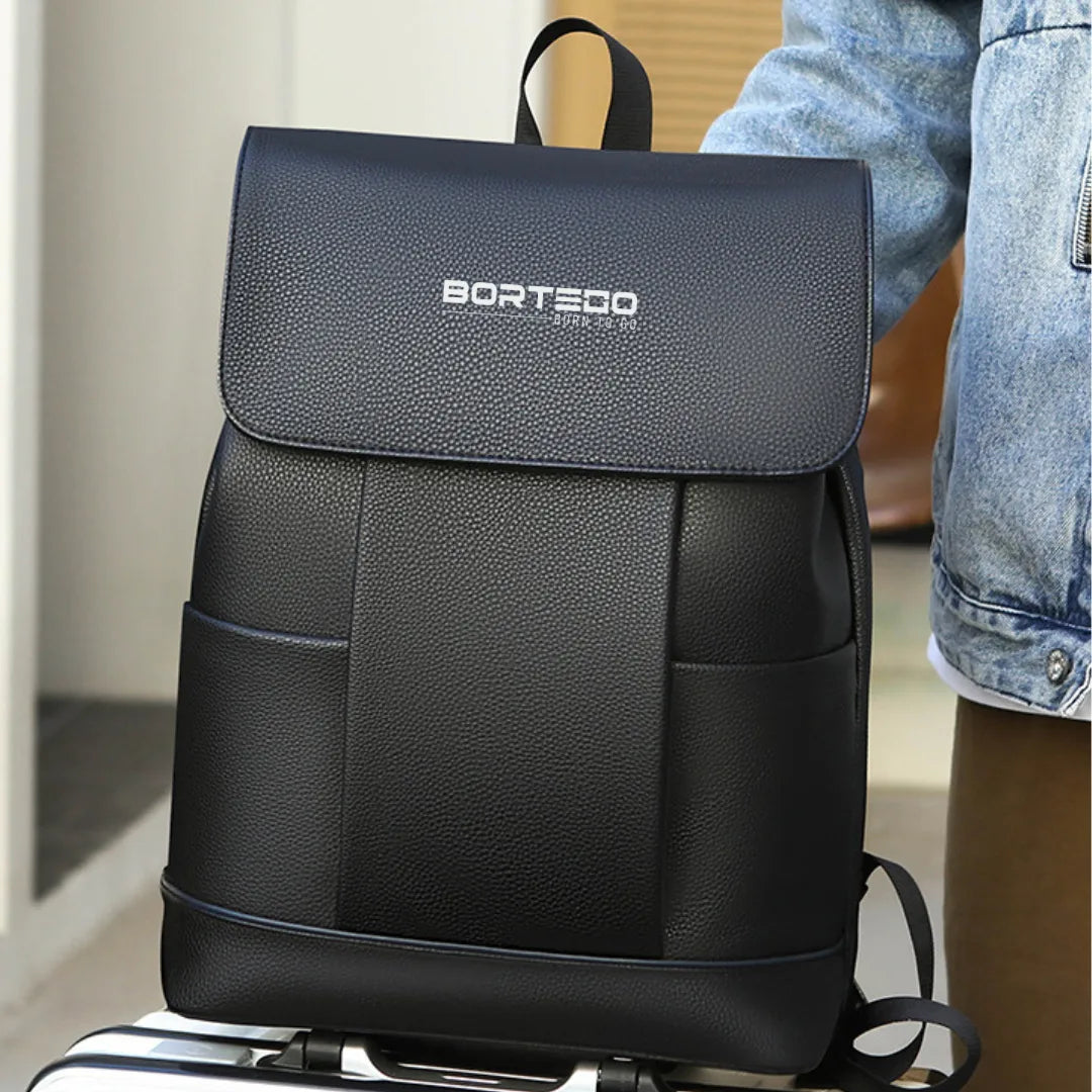 Black backpack with 'Bortedt' logo on a suitcase
