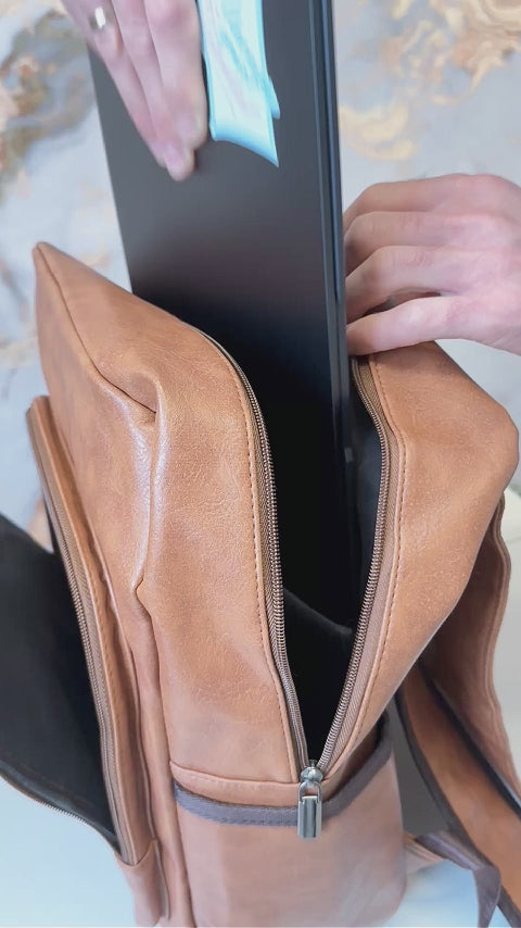 brown leather backpack with laptop compartment