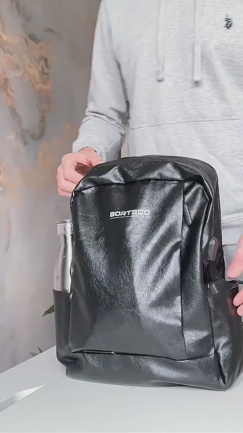 black leather city backpack packing