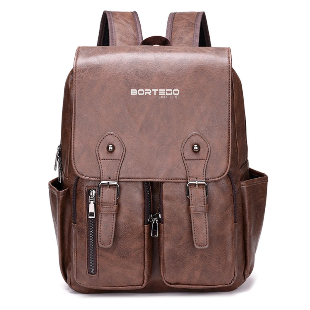 Brown leather backpack with multiple pockets and zippers on a white background